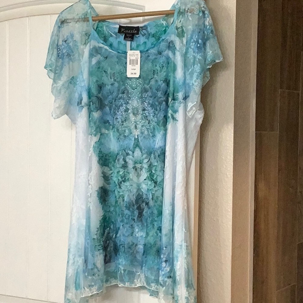 Lovely ladies top.  Very colorful lacy.  Brand new with tags Size Large